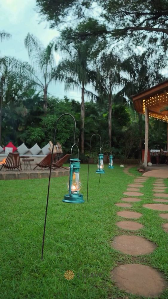 Stepping stones, lanterns and tents as the light drops.