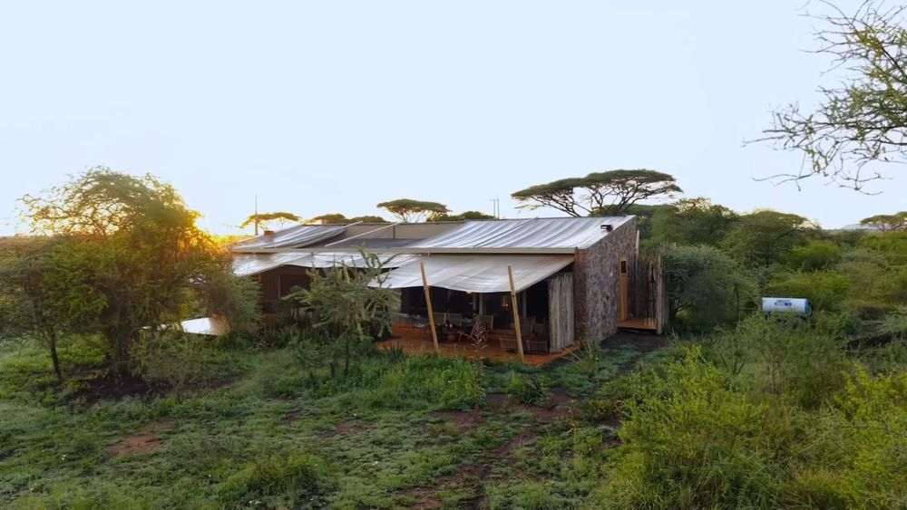 A tented camp framed for film at last light