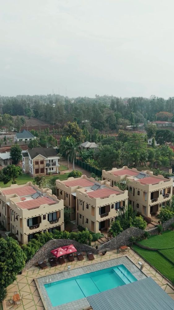 Roofs, gardens and water read from above.