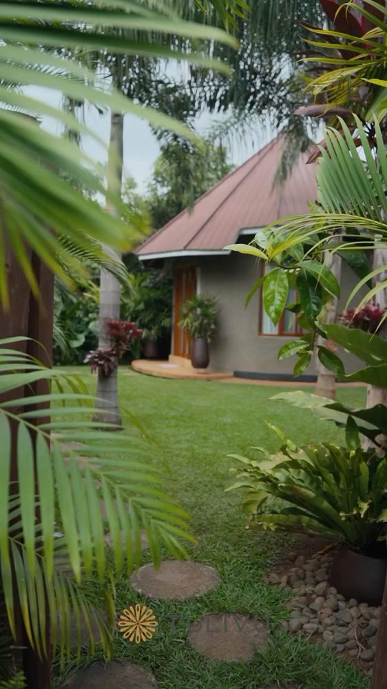 Palms, path and a cottage kept quiet.