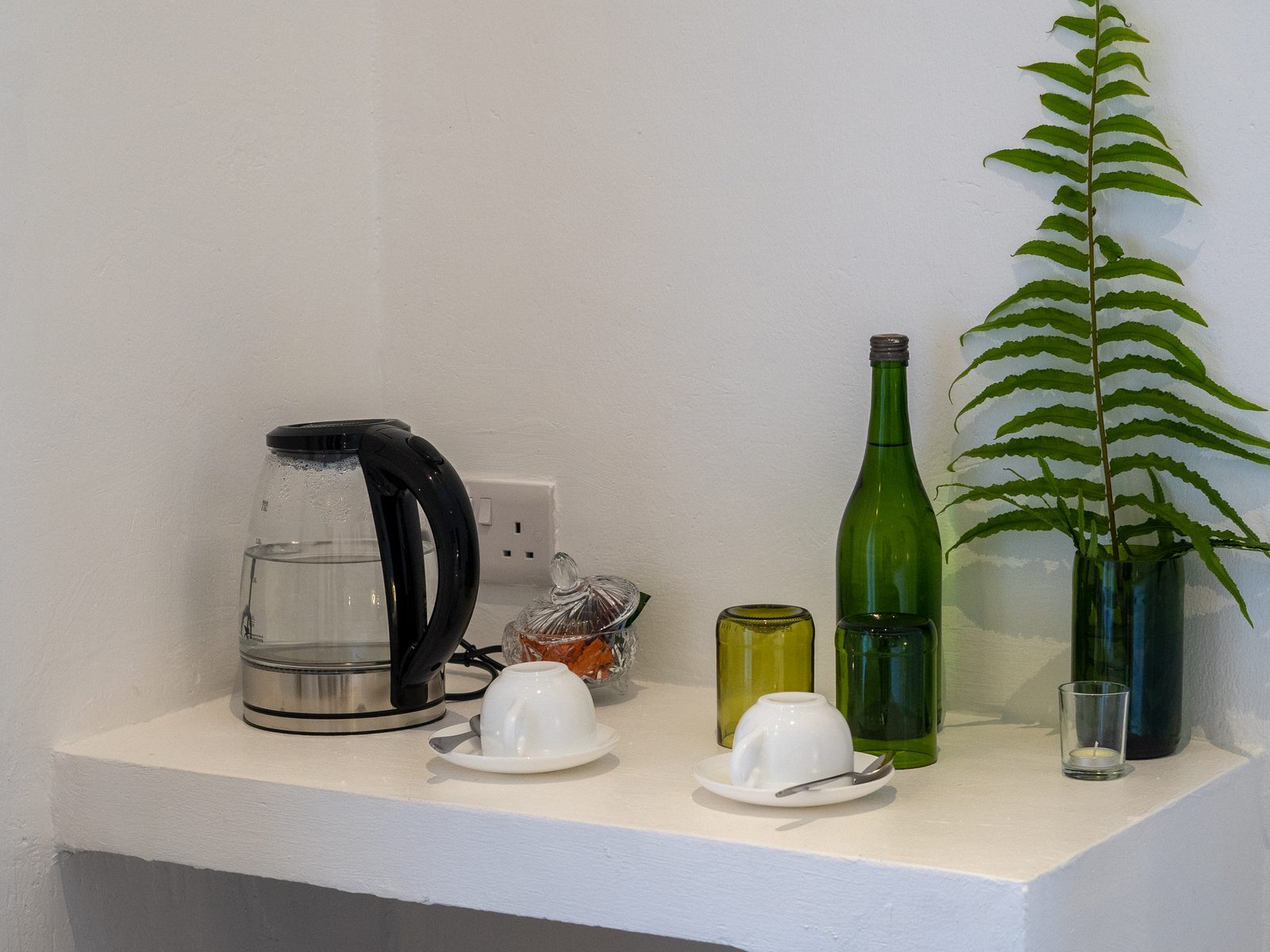 Coffee tray and glassware set out in a suite